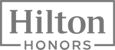 The image shows the Hilton Honors logo, featuring the words "Hilton Honors" framed by lines.