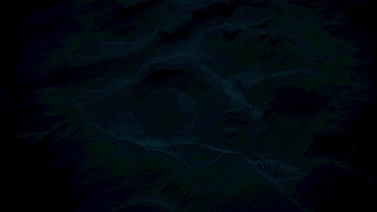 The image is very dark with low visibility, making it difficult to determine any specific details or objects.